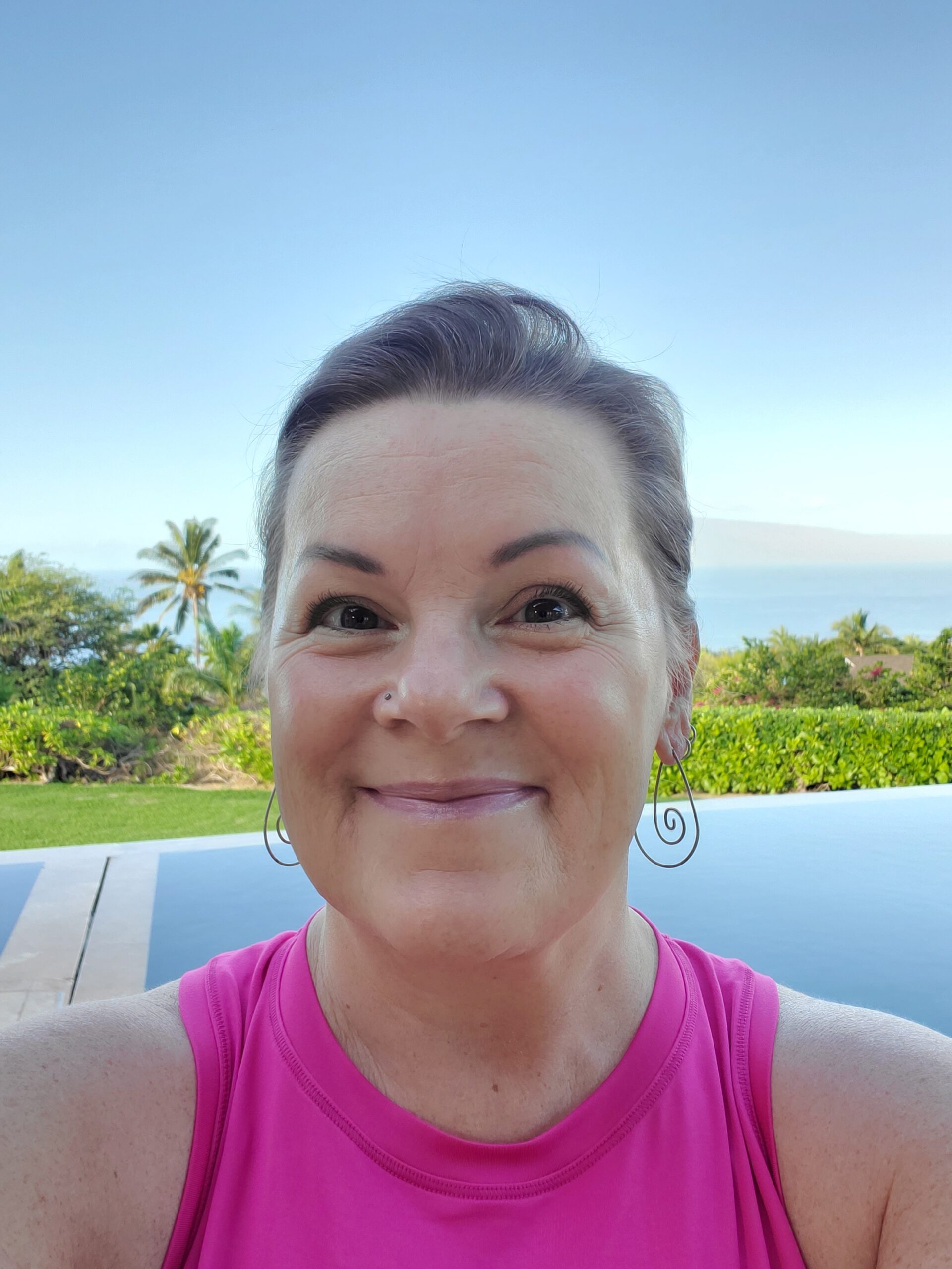 Tanya smiles cheekily from the pool.